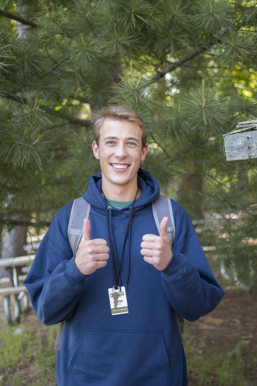 Aaron Milkie giving thumbs up in headshot